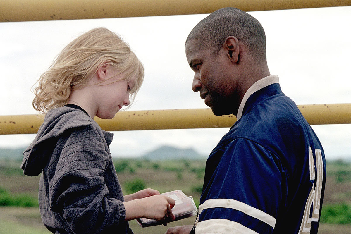 Dakota Fanning con Denzel Washington en "El fuego de la venganza"